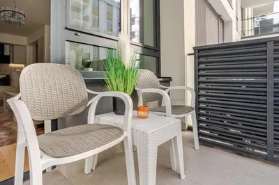 a group of chairs and a table in a room at Belgrade Waterfront - Beograd na vodi in Belgrade