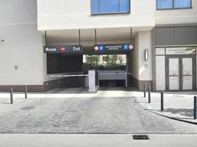 an entrance to a building with a parking lot at Eterna Premium Apartment 1 Bedroom in Sajmište