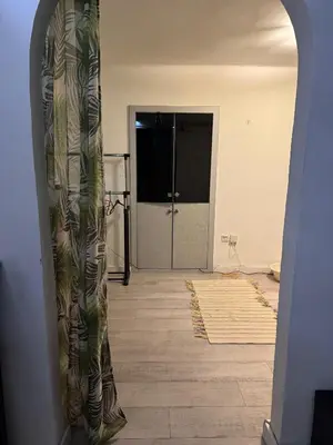 a room with a hallway with a door and a room with a door at BelgradeCenterVibe in Belgrade