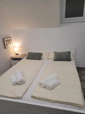 a bedroom with two beds with towels on them at Beosan in Belgrade
