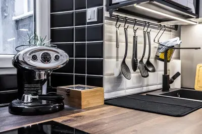 a kitchen counter with a mixer and utensils at City Center Suites, Two Connected Apartments, 10 Guests in Belgrade