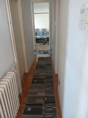 a hallway with a view of a living room at Apartman86 in Beograd