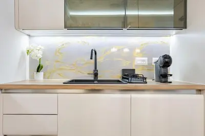 a kitchen with a sink and a coffee maker at Belgrade Waterfront - Beograd na Vodi - Sensa 3 in Belgrade