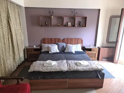 a bedroom with a bed with two towels on it at Apartment Danubius in Belgrade