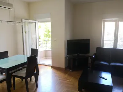 a living room with a couch and a table at Ana's Apartment in Belgrade