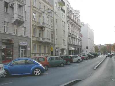 a blue car parked on the side of a city street at Balkan-inn Apartment Terazije in Belgrade