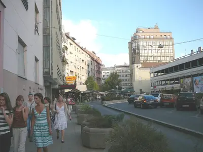 a group of people walking down a sidewalk on a city street at Balkan-inn Apartment Terazije in Belgrade