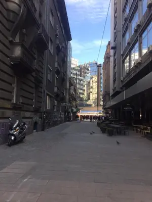 an empty street in a city with buildings at Natalie's Suite in Belgrade