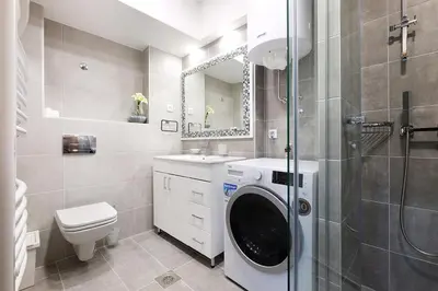 a bathroom with a washing machine in a shower at Apartment Paradise SunShine in Belgrade