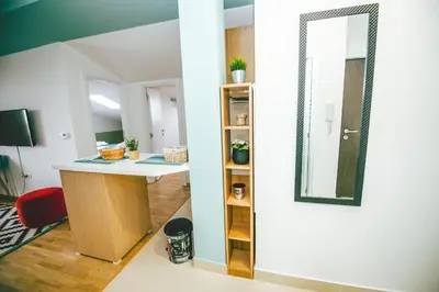 a room with a desk and a mirror at Lola Almost Home in Belgrade