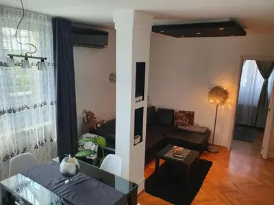 a living room with a couch and a table at Apartment New Belgrade Home in Belgrade
