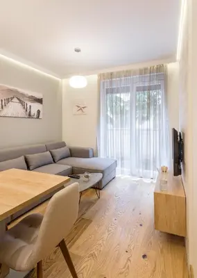 a living room with a couch and a table at Belly2 in Vračar (historical)