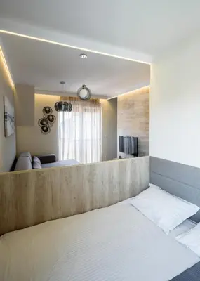 a bedroom with a bed and a living room at Belly2 in Vračar (historical)