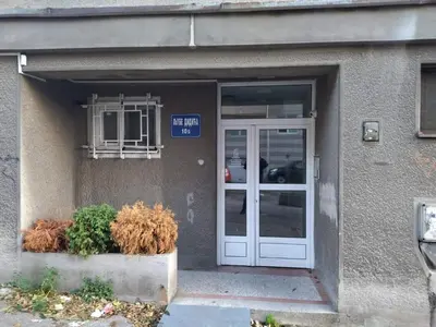 a building with a door and a sign on it at Alba Graeca in Belgrade