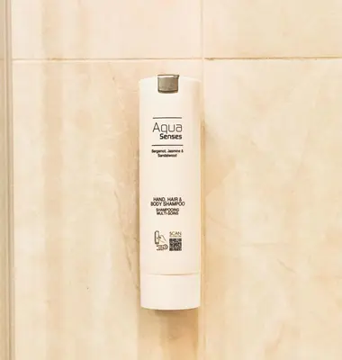 a white bottle of advuana glue sitting on a tile at SLAVNA - Luxe & Wine by the Fortress in Belgrade