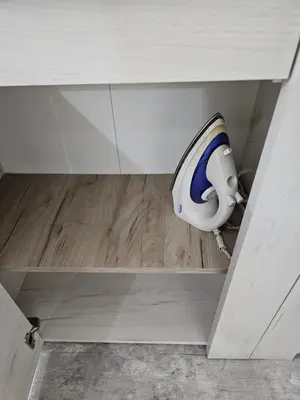 a cabinet with a toilet in the middle of a room at Apartman Viktor in Belgrade