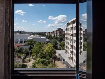 a view of a building from a window at GOFD Apartman in Belgrade