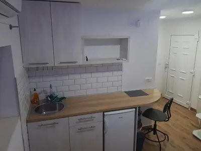 a kitchen with a sink and a counter top at studio skadarlija in Belgrade