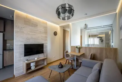 a living room with a couch and a table at Belly3 in Belgrade