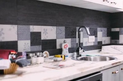 a kitchen with a sink and a counter top at Mici Luxury Apartments in Ledine