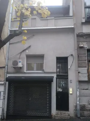 a building with a door and a garage at Studio 10 in Belgrade