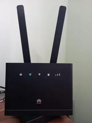 a black router with two antennas on top of it at Sara Apartment in Surčin